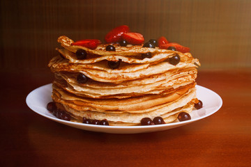 Thin pancakes with crispy crust. Maslenitsa. Pancakes for breakfast and carnival.