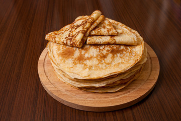 Thin pancakes with crispy crust. Maslenitsa. Pancakes for breakfast and carnival.