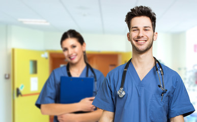 Two nurses smiling in a clinic