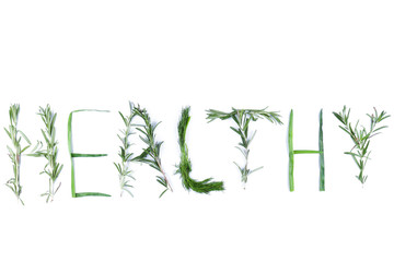 Word Healthy with green herbs. Dill, rosemary and green onions on a white background. The word Healthy is isolated. Letters from natural products. Lettering