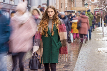 focused woman among the crowd