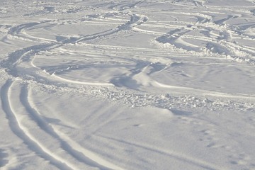 Curvy lines of ski touring tracks in snow