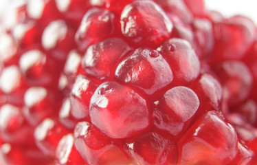 Macro photography fresh pomegranate red seeds background