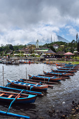 Boats in the lake Beratan and the Pura Ulun Danu Bratan temple