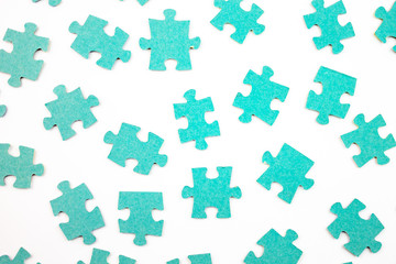Blue pieces of puzzle on white background, top view