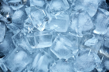 Many ice cubes on color background, top view