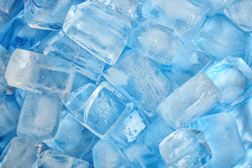Many ice cubes on color background, top view