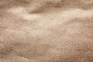 Brown paper bag texture as background, top view