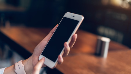 Woman using smartphone, During leisure time. The concept of using the phone is essential in everyday life.