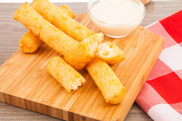 Fried cassava in wood background