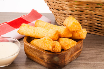Fried cassava in wood background