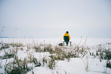 Man alone in winter landscape