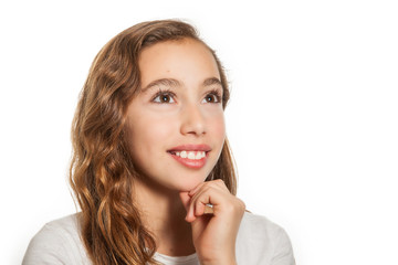 Fototapeta premium Beautiful young girl thinking or having an idea isolated on white background