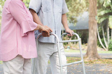 Happy elderly couple with lifestyle after retiree concept. Lovely asian seniors couple walking exercise in the park in the morning.