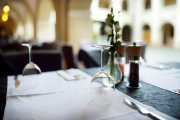 Outdoor restaurant table beautifully decorated with plants and flowers in Vilnius, Lithuania