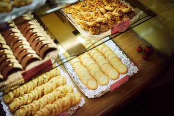 Assorted sweets, cakes and cookies on display in small dessert store in Vilnius