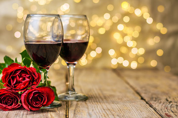 A glasses of wine and roses