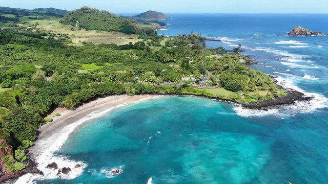 Stunning aerial drone footage of Hamoa Beach, a remote beach near the little town of Hana on the east side of the island of Maui, Hawaii. Hamoa Beach is consistently named one of Maui&rsquo;s Best Beaches.