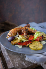 Baked chicken with herbs and vegetable salad