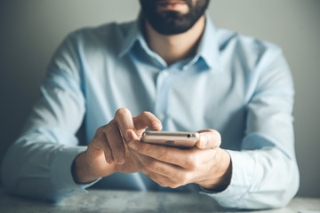 man touching smart phone screen