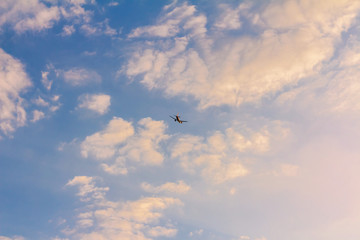 Airplane in the sky and cloud at sunrise