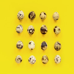 Pattern set of quail eggs on yellow paper background. Easter concept. Template Creative Flat lay Top view
