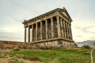 Fototapeta na wymiar Side view of the medieval pagan temple built in honor of the Sun God Mithras in the village of Garni, located near Yerevan