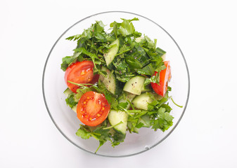 salad in transparency glass bowl isolated on white background