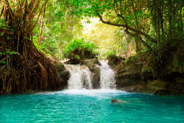 Kawasan waterfall in a mountain gorge in the tropical jungle of the Philippines, Cebu.