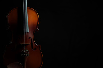 Violin in black isolated background copy space composition