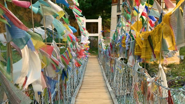 Suspension bridge covered in prayer flags near Paro, Bhutan