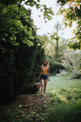 Woman walking barefoot through the grass