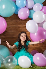 Fototapeta na wymiar Girl child with balloons