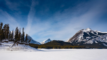 Winter in the mountains under clear blue skies