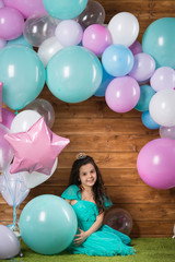 Girl child with balloons