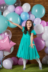 Girl child with balloons