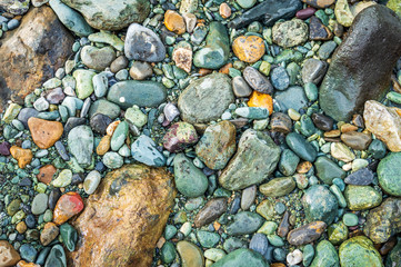 A coarse surface. Groung covered with pebbles. Rough terrain