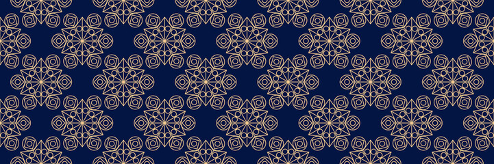 Seamless background. Golden blue geometric pattern