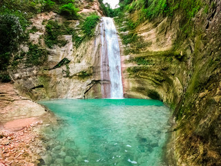 Dao waterfalls in a mountain gorge in the tropical jungle of the Philippines, Cebu.