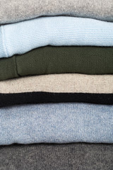 Winter and fall cozy sweaters stack, woolen sweaters