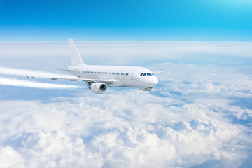 Fototapeta na wymiar Airplane flies above the clouds. Travel concept.