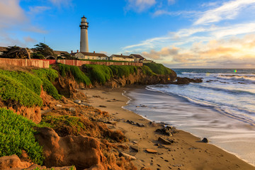 Fototapeta na wymiar Pigeon Point Lighthouse on Northern California Pacific Ocean coastline just before sunset