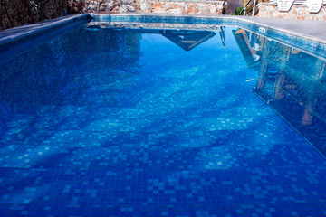  Clean, clear, blue water in the pool on the territory of the cottage. Outdoor activities near the outdoor pool with blue water. 