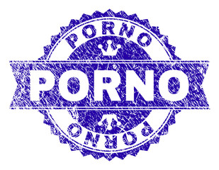 PORNO rosette stamp watermark with grunge style. Designed with round rosette, ribbon and small crowns. Blue vector rubber watermark of PORNO label with corroded style.