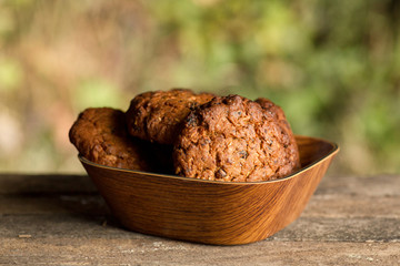Assortment of fresh baked goods wooden background. baguette and cookies in the open space