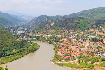 Obraz premium Aerial view on old town Mtskheta and confluence of the rivers Kura and Aragvi in Georgia