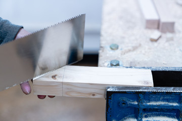 Obraz premium Technician handles a variety of woodworking tools to make wooden products. Both hand and machine tools are used after carpenters measure exact size by different types of rulers.