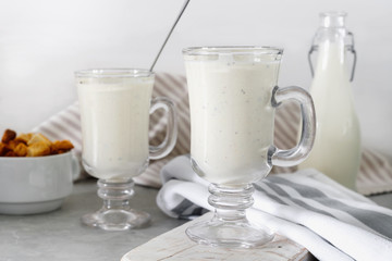 Fresh blended  kiwi protein smoothie with yogurt or milk in glass jar, healthy eating