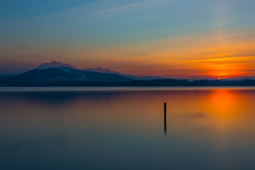 Fototapeta na wymiar mount Pilatus and lake Zug at sunset, blue sky