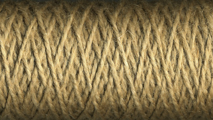 Natural jute twine roll, skein of jute thread texture. micro shot of a coil of jute twine. Supplies and tools for handmade hobby leisure closeup.
